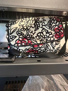 Coach Poppy Kyra Messenger Bag front flap. GUC